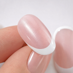 Close-up of Blush Veil short square blush pearl French press-on nails showing soft pink glossy finish