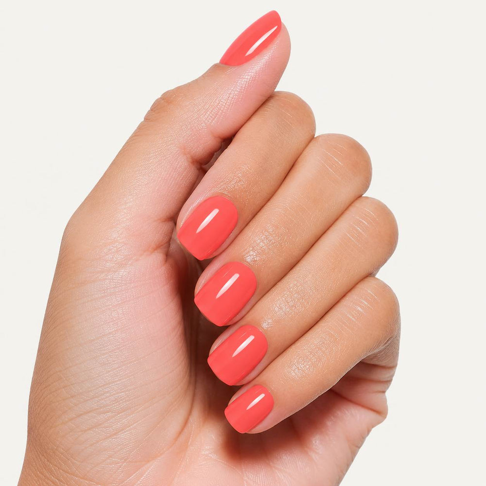 Peach Glow peach coral glossy short square press-on nails with vibrant warm pink finish