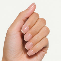 Nailora Champagne Whisper Glossy Square Press-On Nails with soft nude pink color, champagne shimmer tips, glossy finish, and reusable salon-quality design