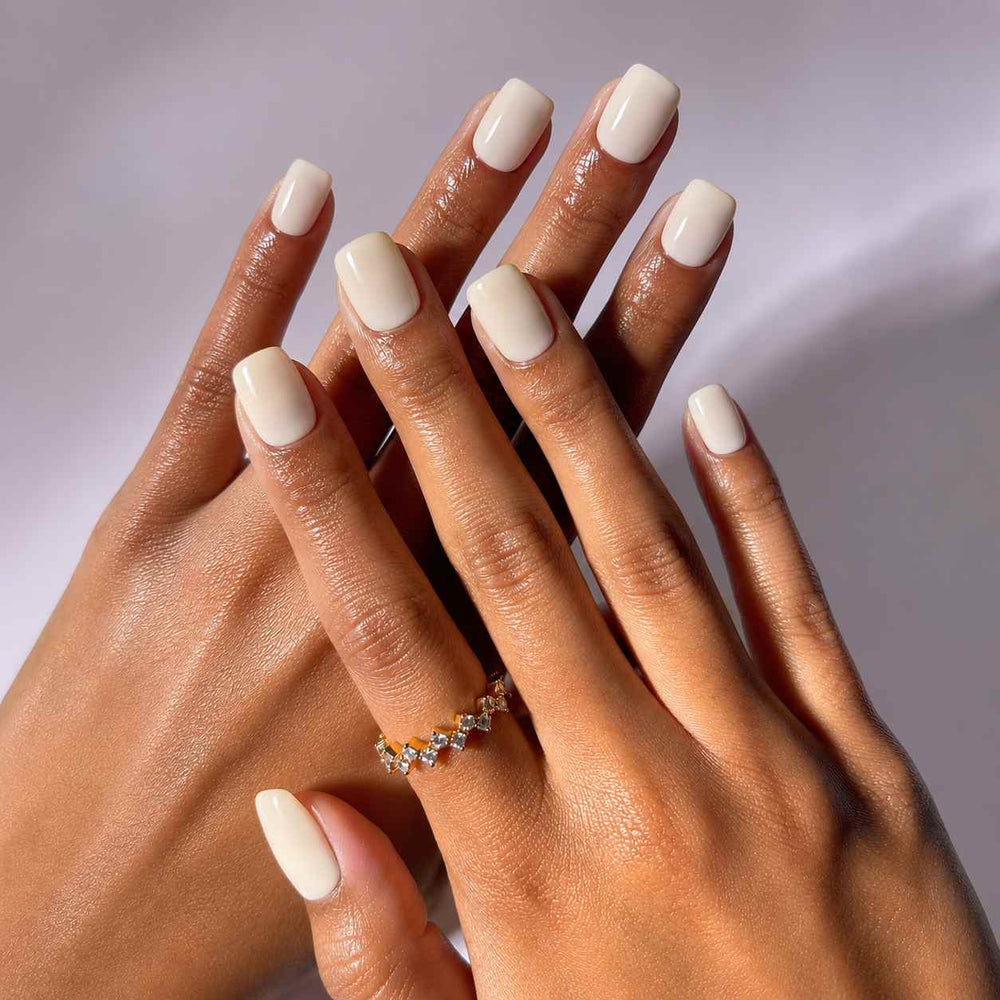 Nailora Vanilla Cloud Glossy Square Press-On Nails featuring a soft vanilla white color, short square shape, high-shine finish, and elegant salon-inspired manicure look.