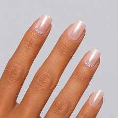 Close-up of Bare Luxe pearl pink crystal square and oval press-on nails showing crystal accents and luminous pearl finish
