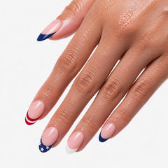 Woman showing reusable press-on nails with glossy finish and patriotic French manicure style
