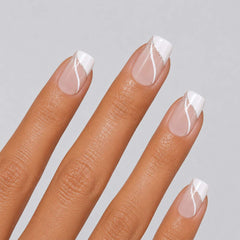 Close-up of Ivory Spark short ballerina French press-on nails with fine glitter line details