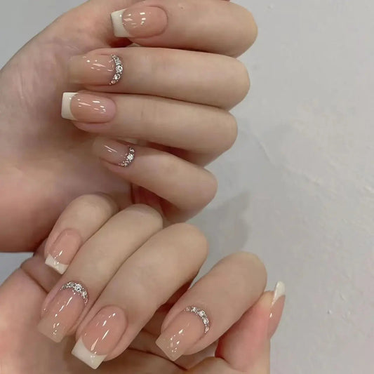Nude French tip press-on nails with crystal accents for weddings