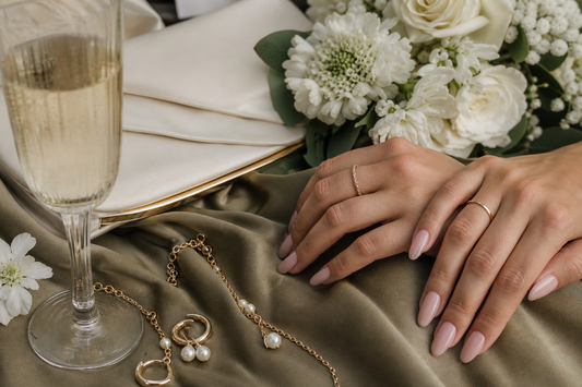 Soft nude almond press-on nails styled with a khaki wedding guest dress