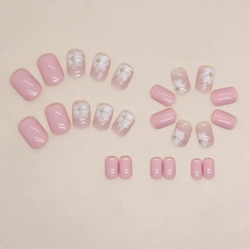 Blush Blossom press-on nails applied