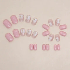 Blush Blossom press-on nails applied