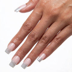 Champagne Glow short square French ombre press-on nails with champagne glitter tips on hand