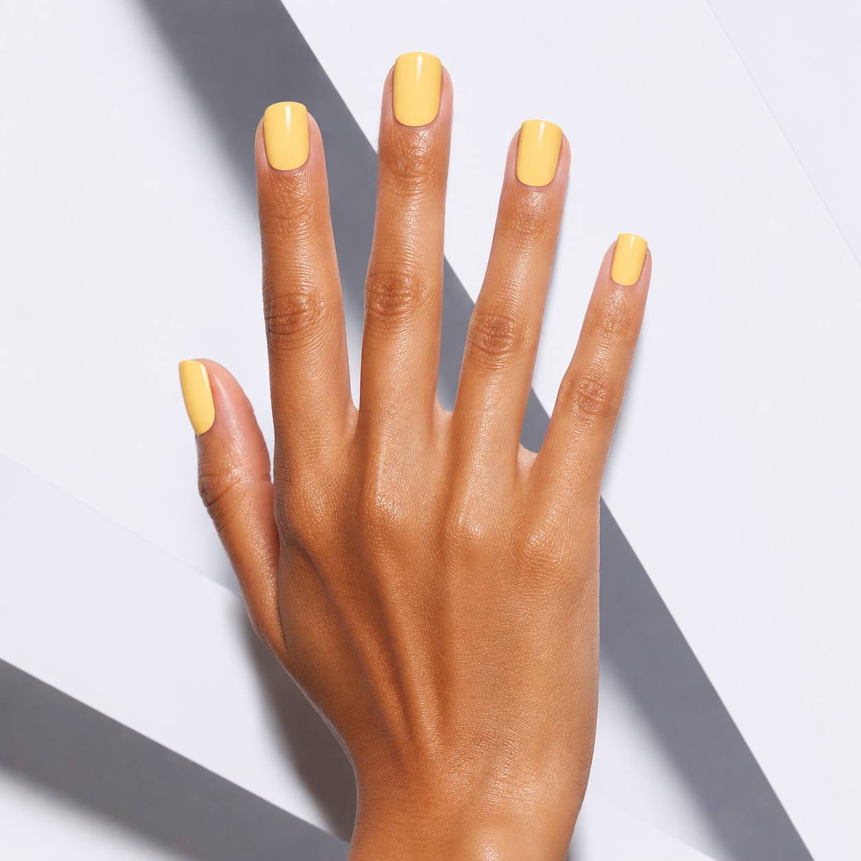 Nailora Lemon Sorbet Glossy Square Press-On Nails with soft pastel yellow color, square shape, glossy finish, and reusable salon-quality design