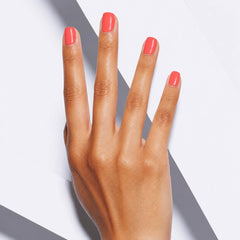 Peach Glow peach coral press-on nails styled for summer vacations and warm-weather outfits