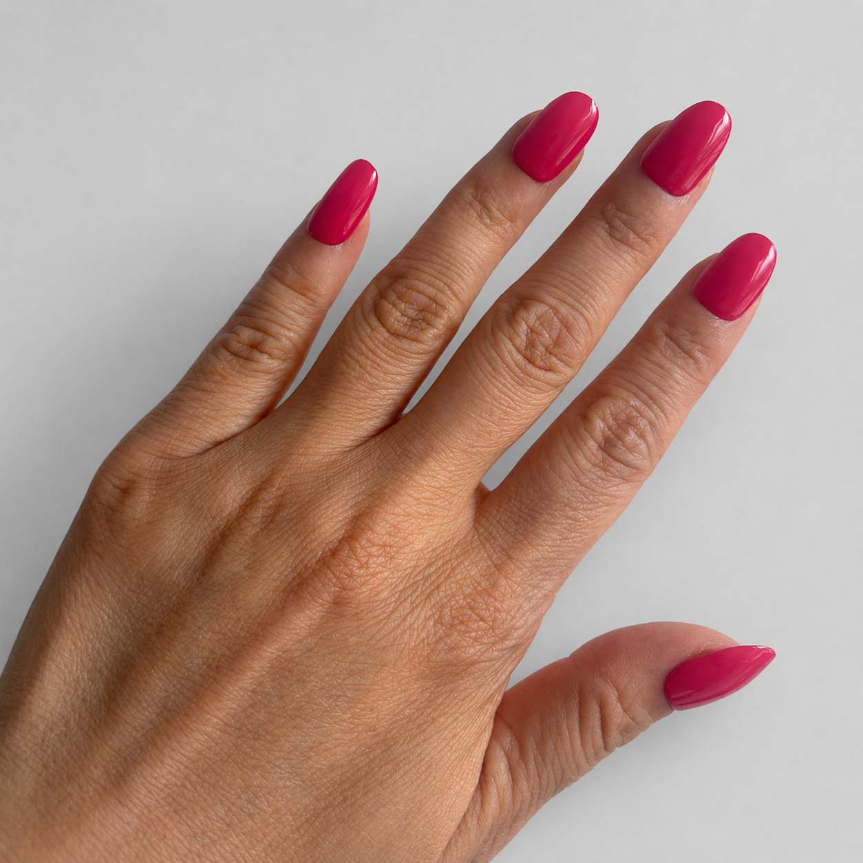 Nailora Dragon Fruit Pink Glossy Short Oval Press-On Nails featuring a vibrant dragon fruit pink shade with a reusable salon-quality finish for summer styling, vacations, and everyday fashion.