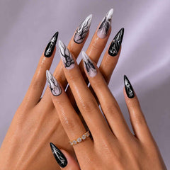 Midnight Veil gothic press-on nails glossy black stiletto shape with dark romantic art design