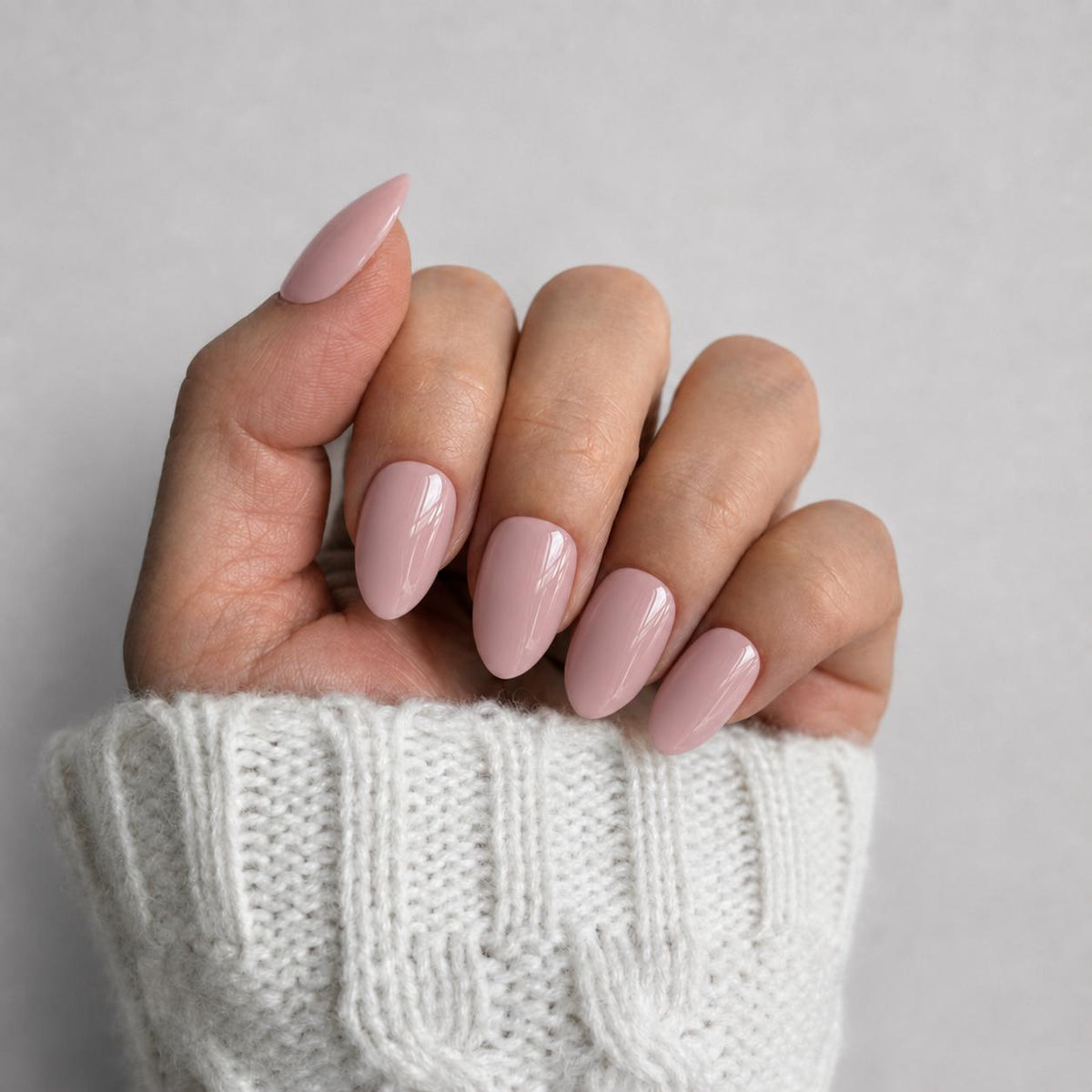 Nailora Soft Blush Glossy Short Almond Press-On Nails featuring a delicate light pink shade with a reusable salon-quality finish for everyday wear, bridal styling, office looks, and minimalist fashion.