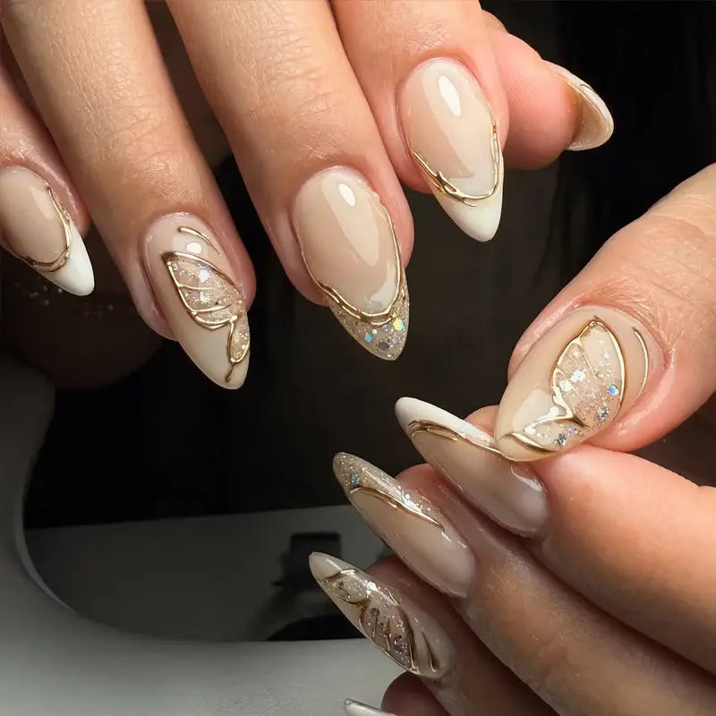 Golden Flutter press-on nails on hand