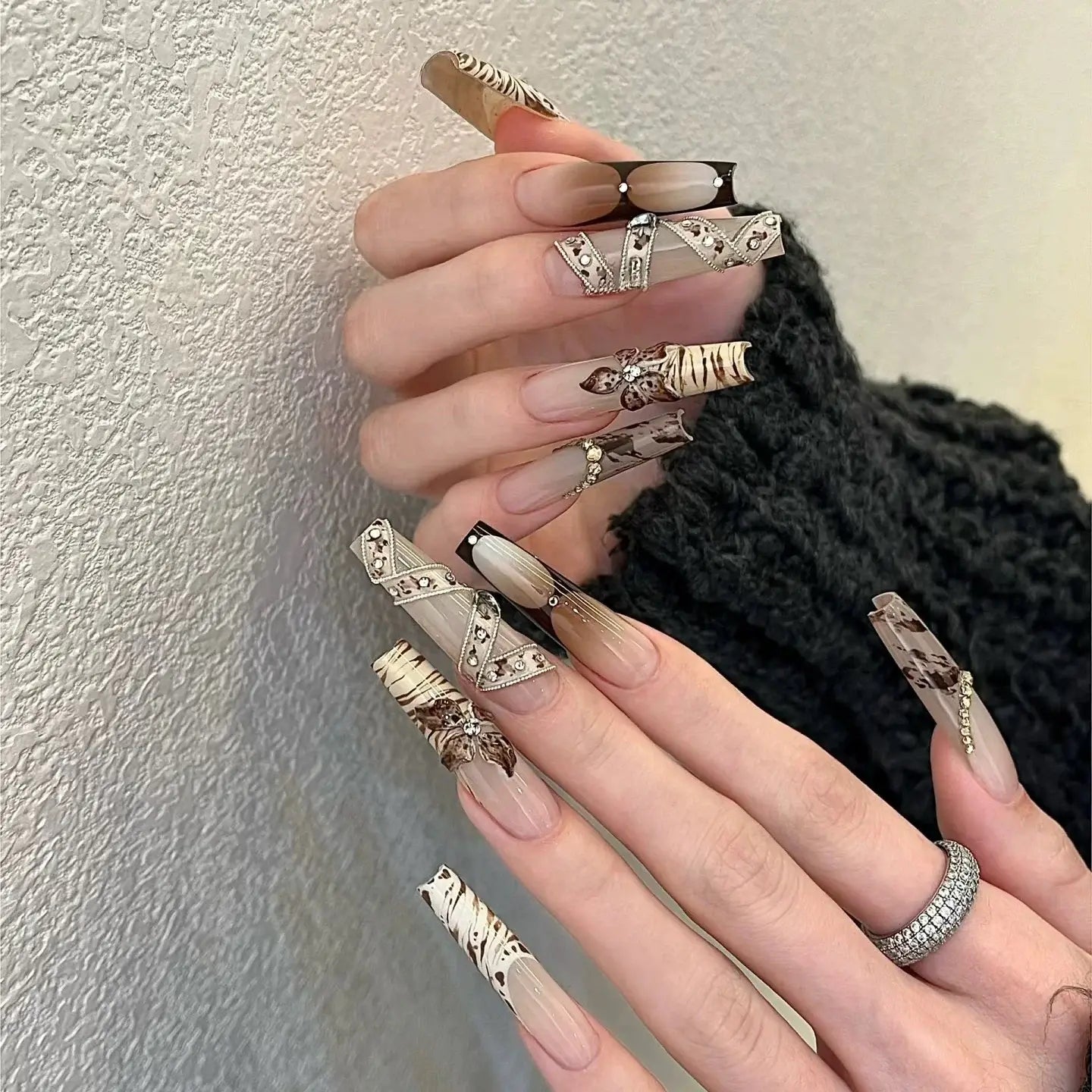 Wild Muse press-on nails on hand