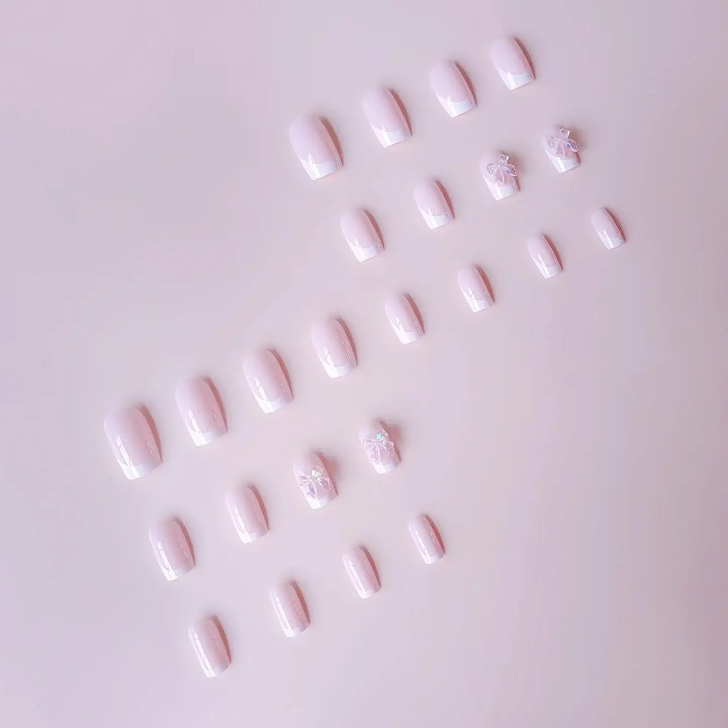 Pink Satin press-on nails on hand