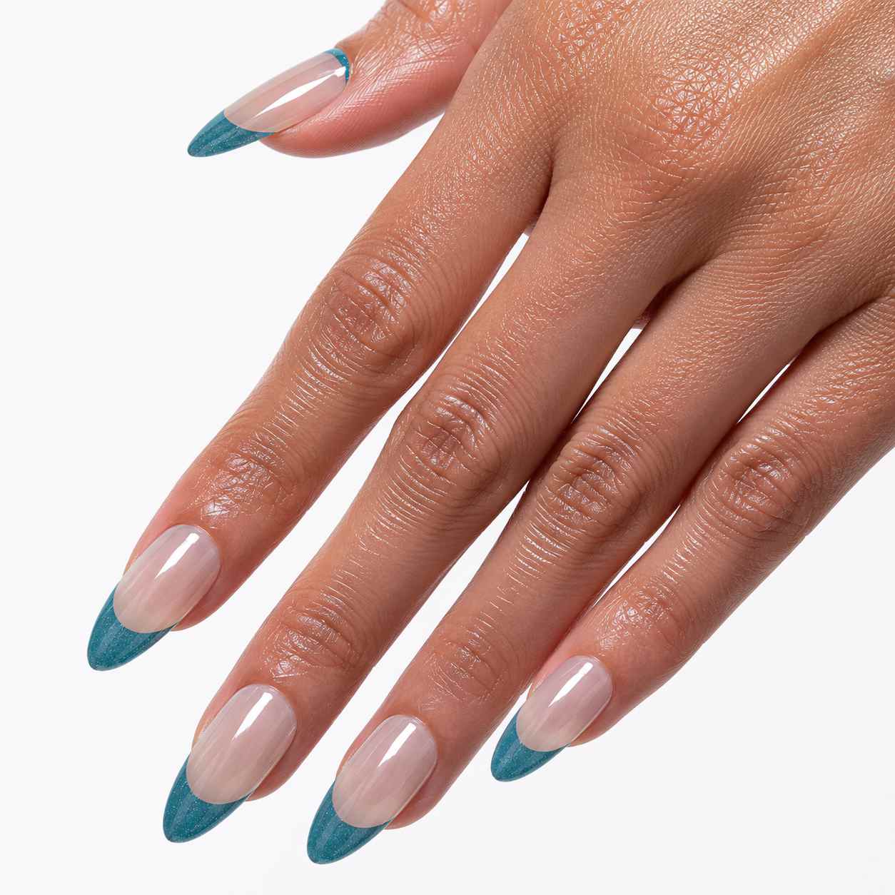 Close-up of Halo Veil almond press-on nails showing blue-gray cat-eye French tips and glossy finish