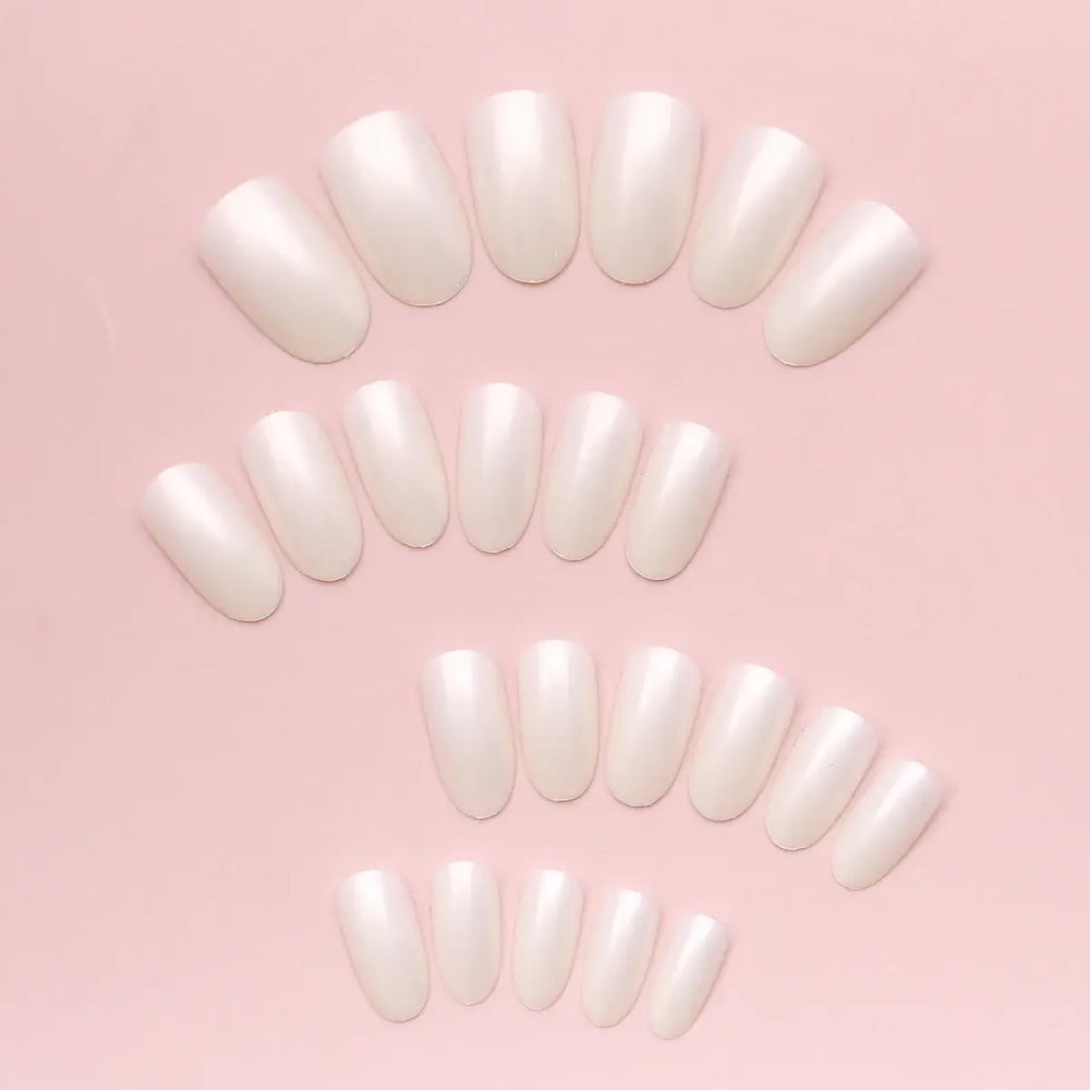 Glazed Pearl press-on nails on hand