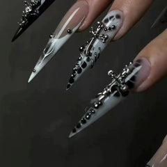 Obsidian Glow Gothic Black Chrome Stiletto Press-On Nails on hand