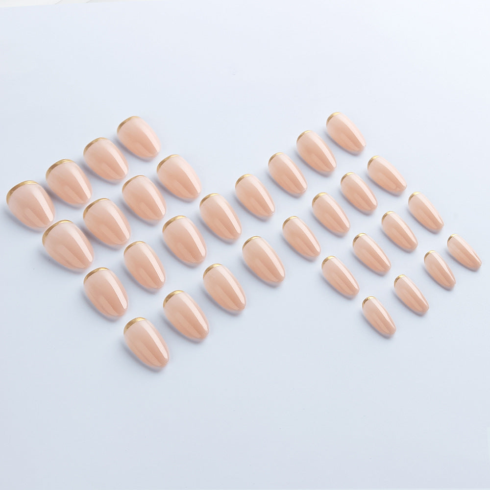 Luxe Nude press-on nails applied