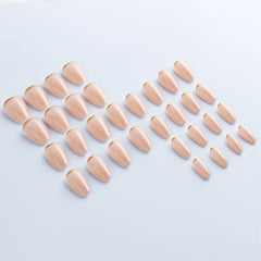Luxe Nude press-on nails applied