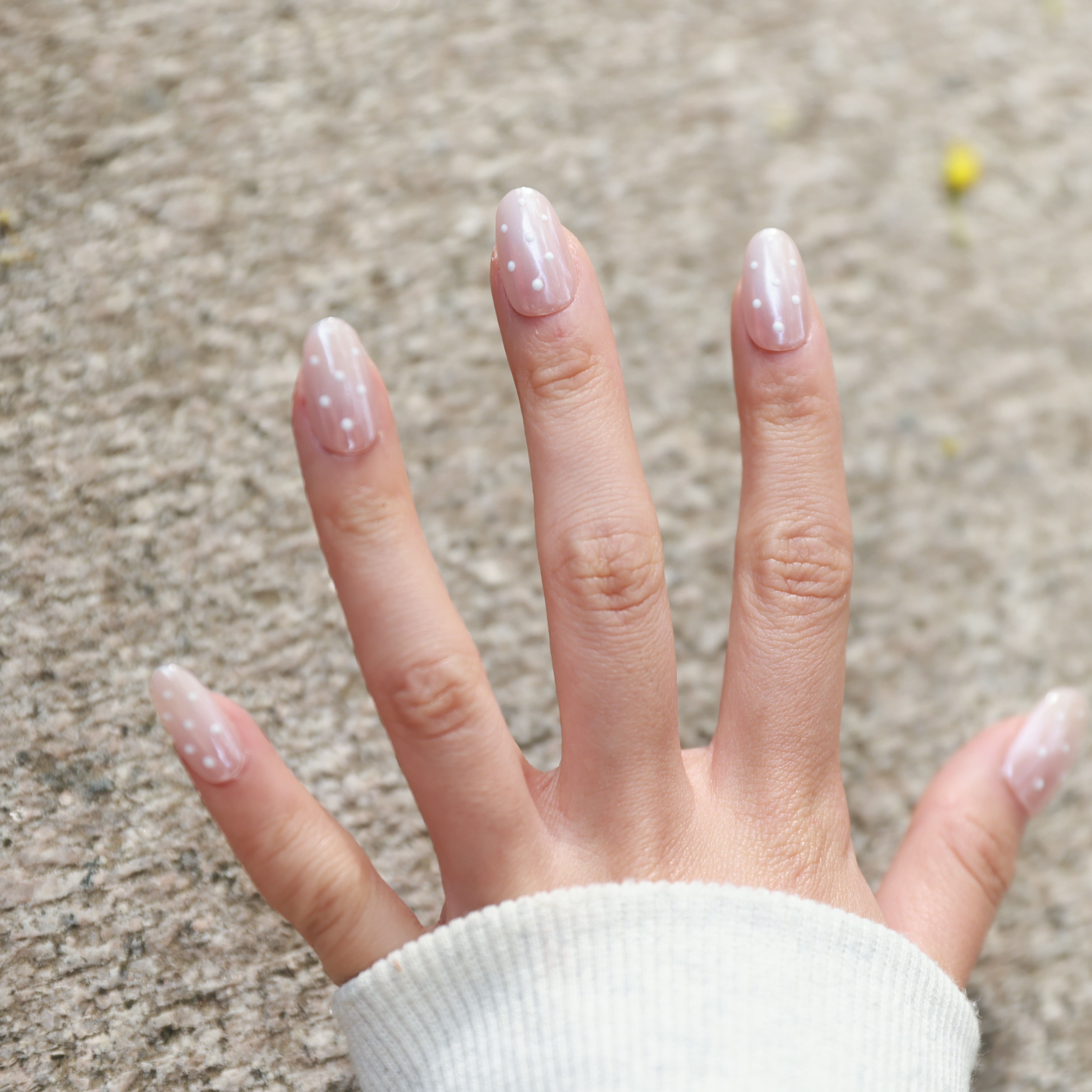 Bare Charm press-on nails on hand