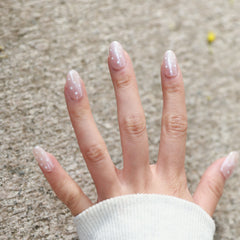 Bare Charm press-on nails on hand
