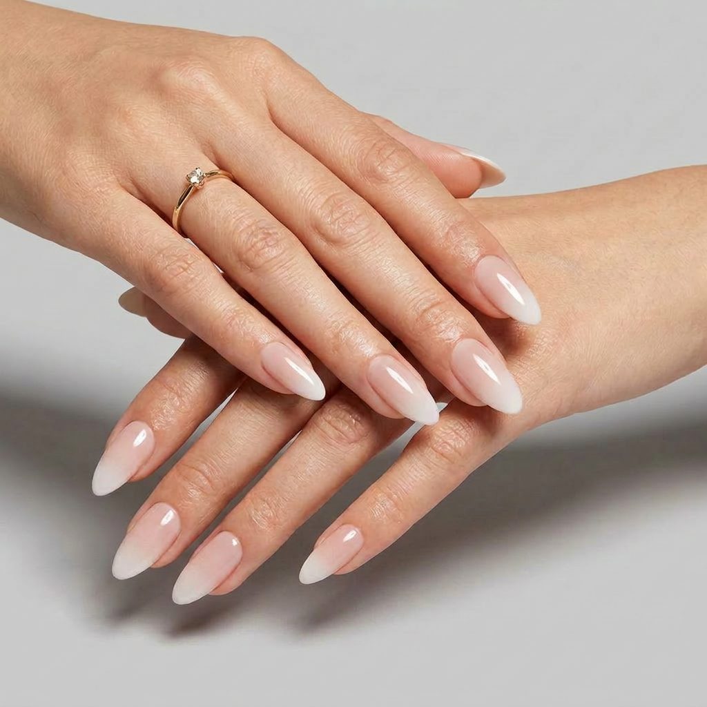 Close-up of a hand with a ring on a neutral background
