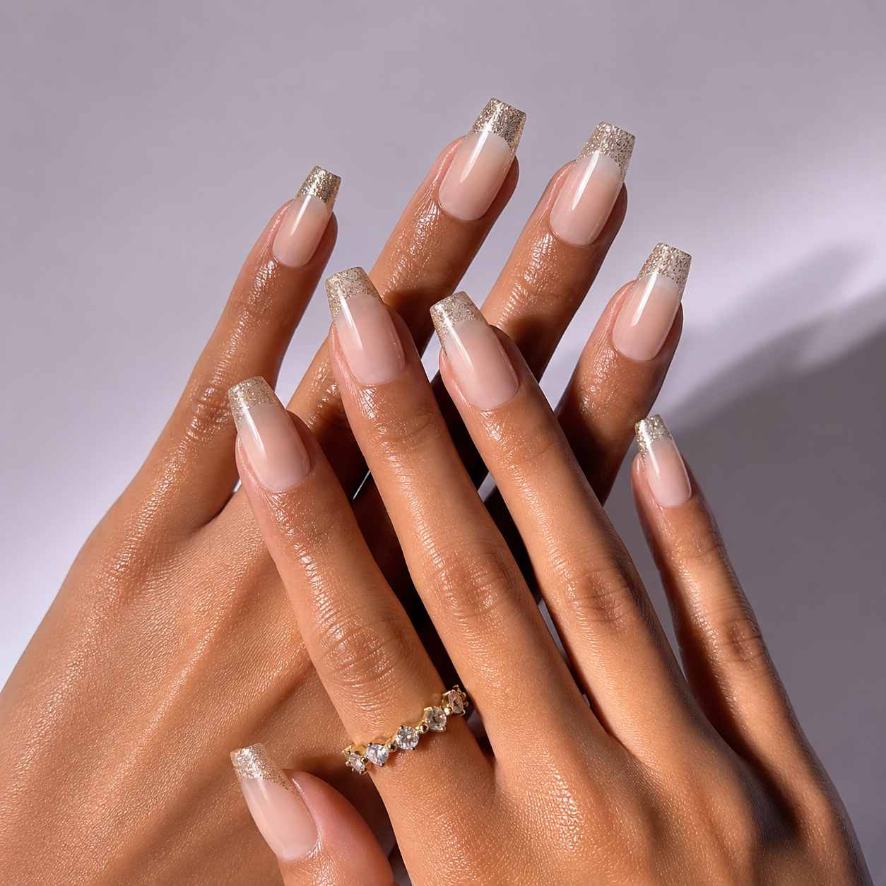 Golden Champagne press-on nails on hand