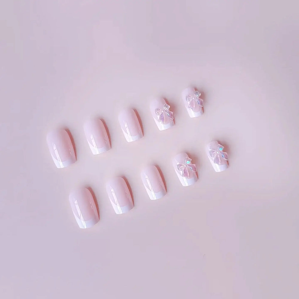 Pink Satin press-on nails applied