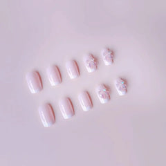 Pink Satin press-on nails applied