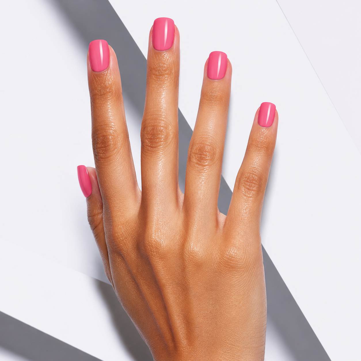 Nailora Bubblegum Pink Glossy Square Press-On Nails styled for playful summer elegance with vibrant pink color and modern feminine aesthetic